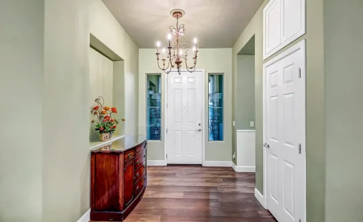 To utilize the full potential of the high ceilings in this home, TWD built custom upper cabinets featuring touch-latch hardware to maximize the unused space above the closets.